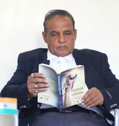 Murlikant sir holding his own Book - Courage beyond Compare
